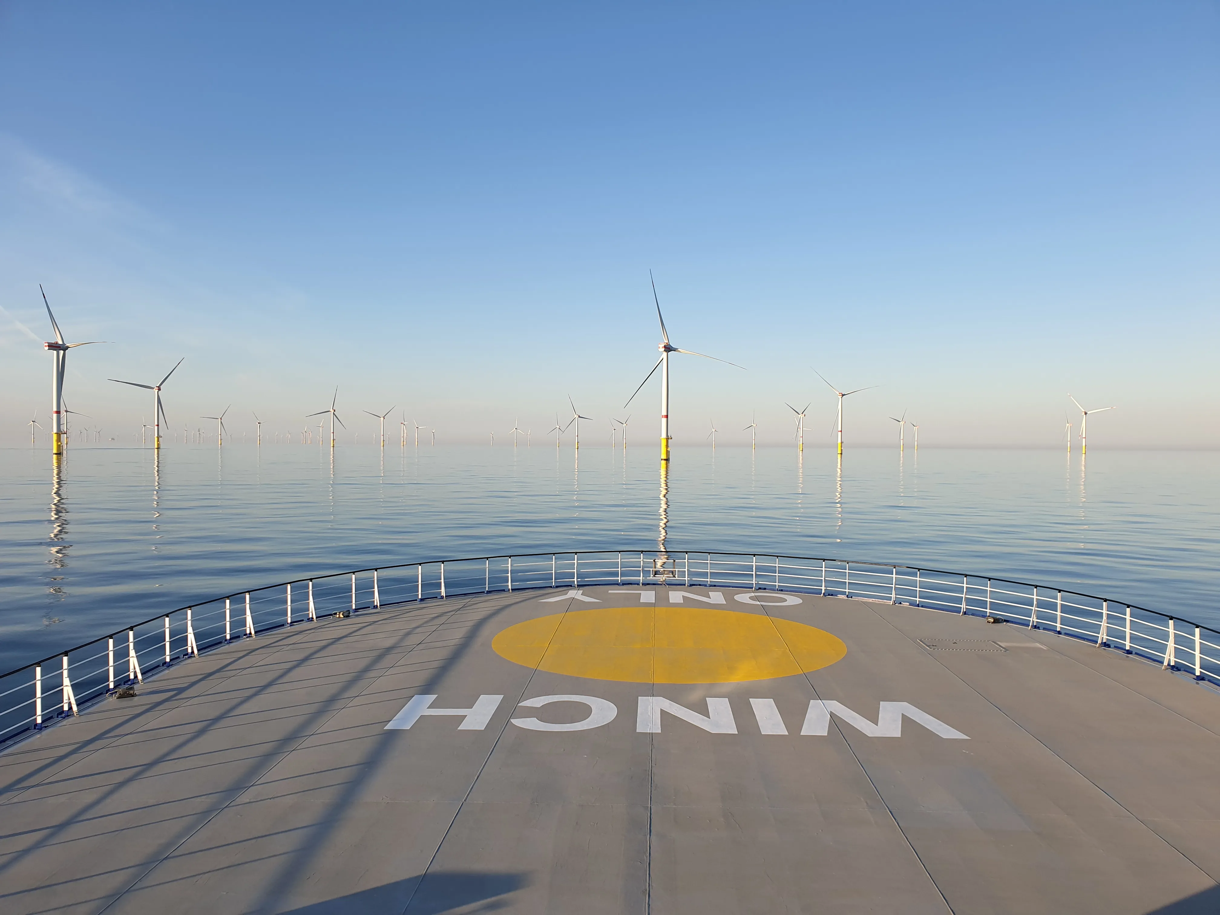 View from the deck of an offshore vessel looking out across an offshore wind farm