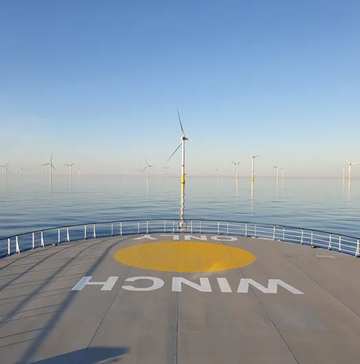 View from the deck of an offshore vessel looking out across an offshore wind farm