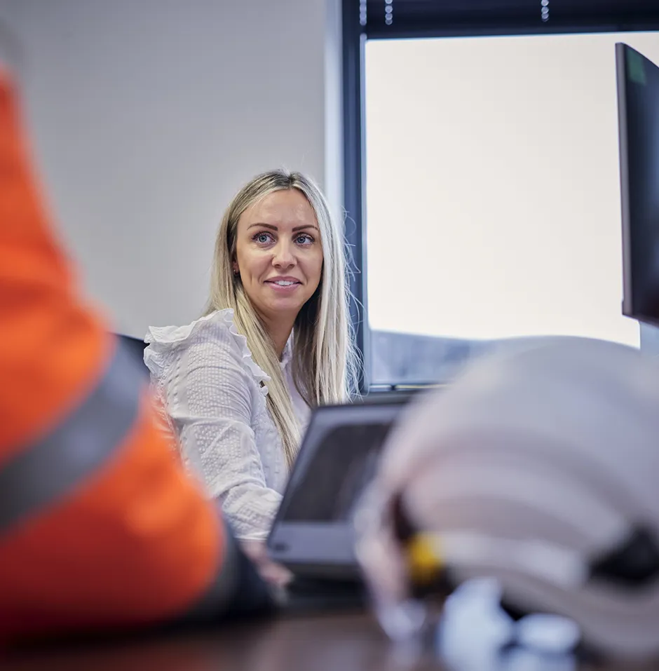 Freight operator at work talking to colleague