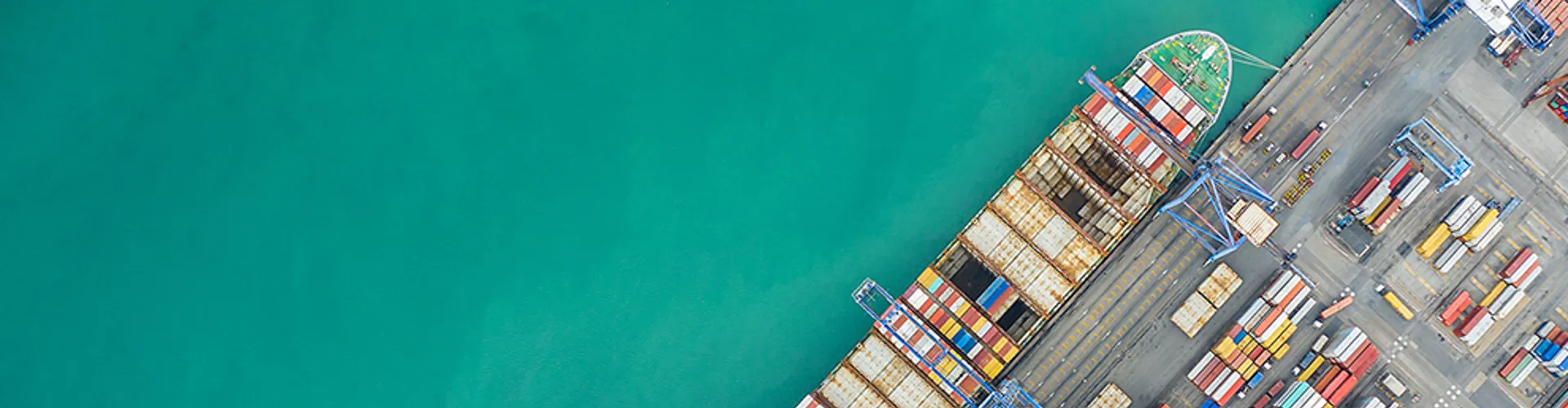 Aerial top view container cargo ship working. Business import export logistic and transportation of International by ship in the open sea.