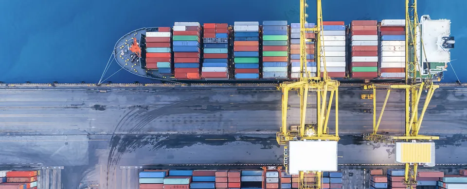 aerial top view container ship crane Lifting container for Logistic by sea in warehouse