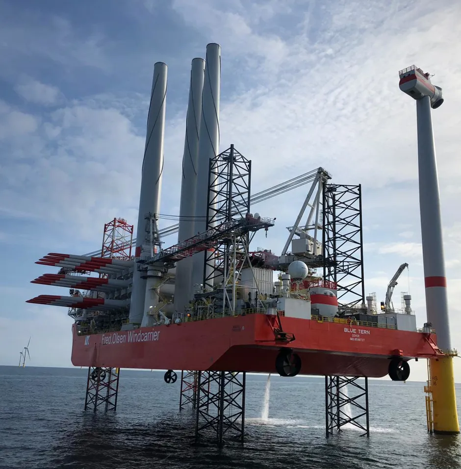 Offshore wind turbine installation vessel at sea.