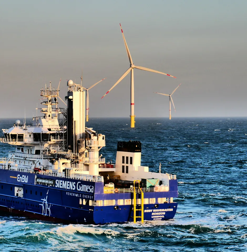 A service ship near offshore wind turbines.