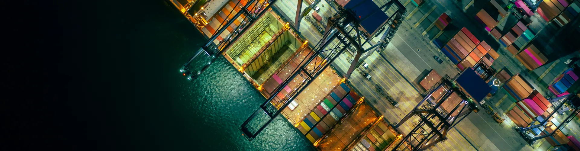 Aerial view of container port at night