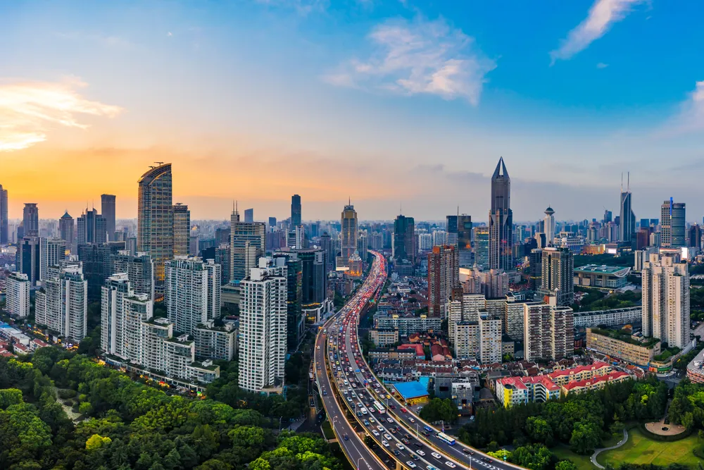 City skyline panorama at sunset with highway