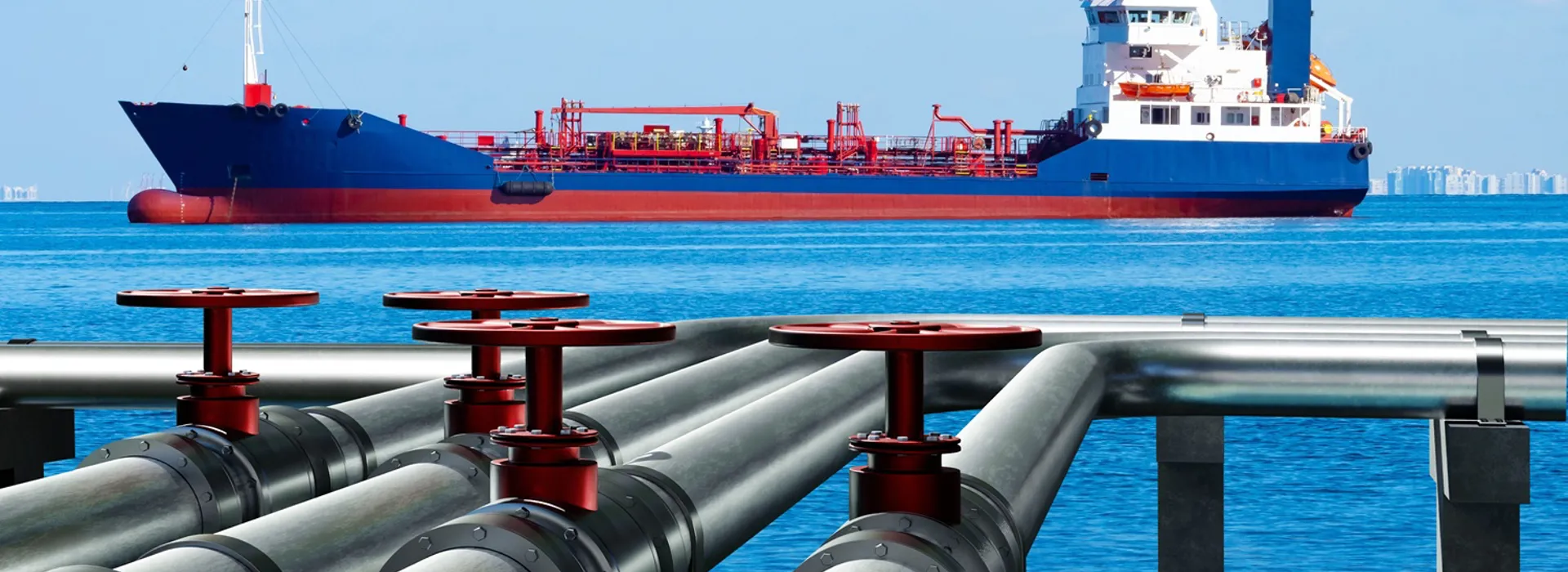 Cargo ship anchored near industrial pipeline infrastructure