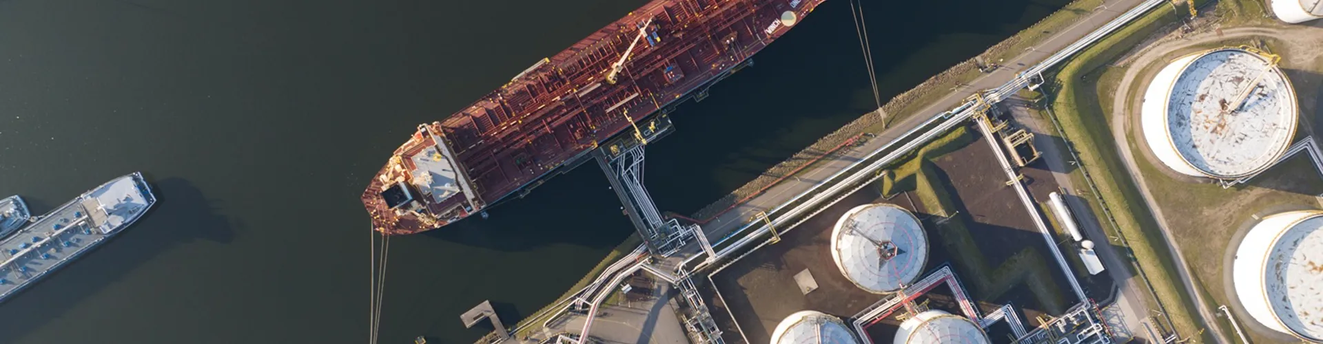 Aerial view of cargo ship at industrial dock
