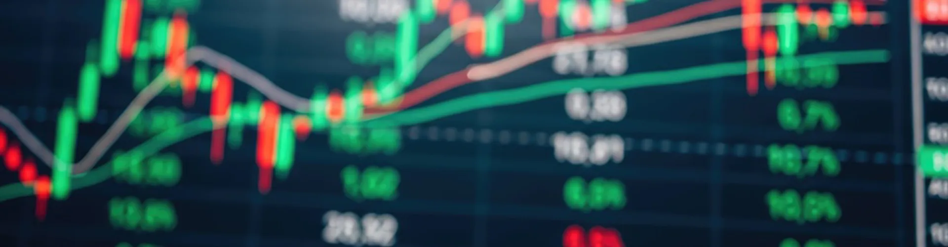 Blurred trading screen showing a candlestick chart of market prices