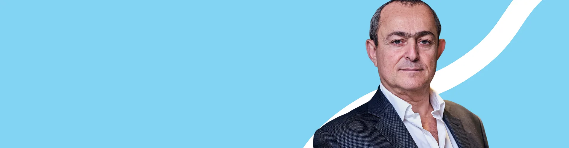 CFO, blue background, man looking