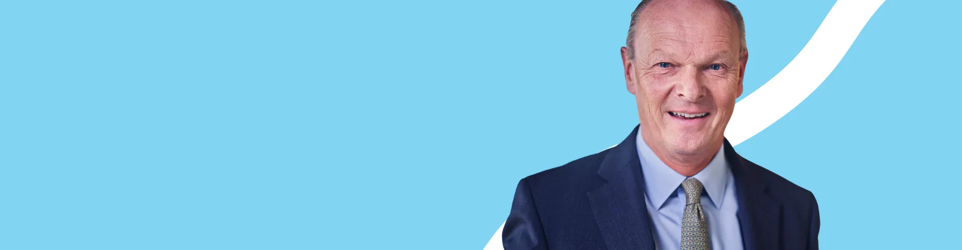 Chair, blue background, man looking