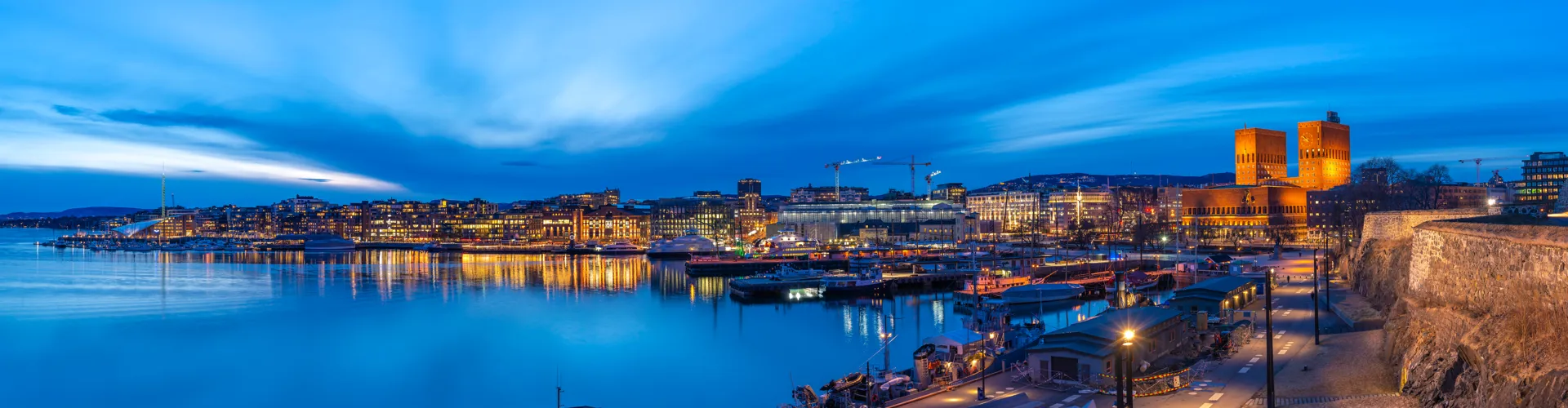 Oslo City Hall and harbour lit up at night